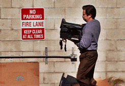 Ron Swanson throwing a computer into the dumpster